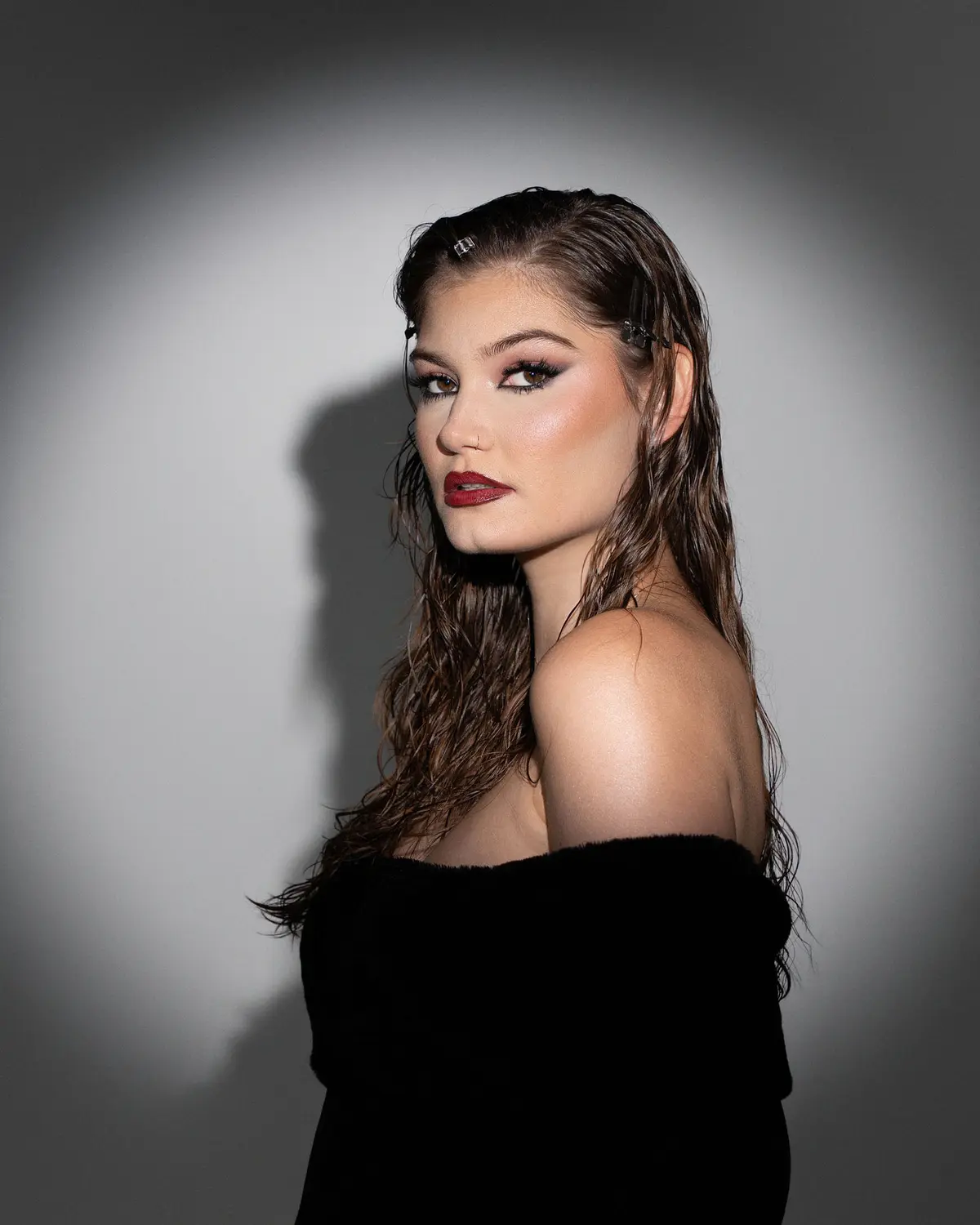 Dramatic spotlight glamour portrait with studio lighting in Orlando, Florida by Pottinger Studios