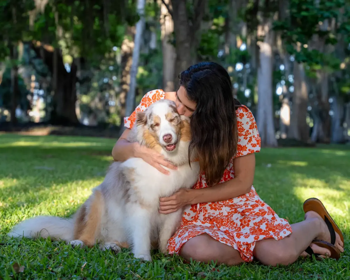 Family session with a beloved dog at an Orlando-area park by Pottinger Studios